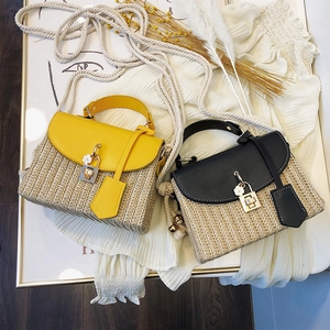 Vintage straw woven handbag for women with leather trim and floral charm in yellow and black