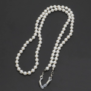 Elegant 70cm gold beaded eye chain featuring faux pearls on a black background
