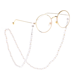 Golden round frame metal glasses with elegant faux pearl beaded lanyard chain accessory