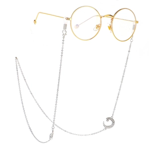 Silver eyewear chain with rhinestone crescent moon charms on minimalist metal link strap