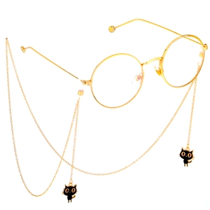 Lunettes rondes dorées avec chaîne en métal et breloques de chat noir chic