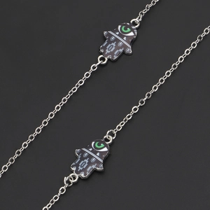 Silver Hamsa Hand and Evil Eye eyeglass chain with intricate geometric patterns