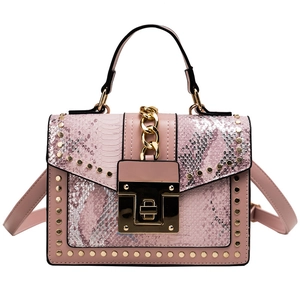 Pink patchwork handbag with snakeskin texture, gold rivets and metallic chain strap