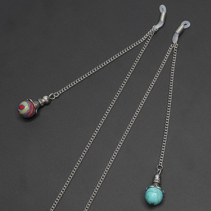 Detail of silver eyewear chain featuring natural stone beads and silicone loops