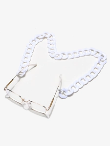Detail of white acrylic thick chain link strap for eyewear on a light background