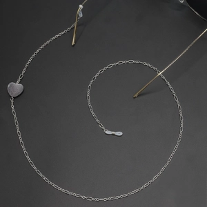 Silver chain eyewear strap featuring a matte purple heart pendant and non-slip rings