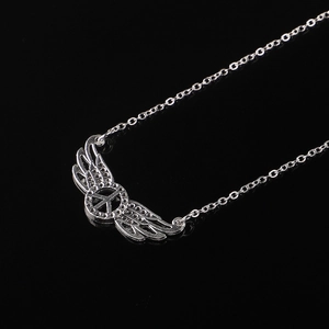 Silver eyewear chain with wing and peace sign pendant on black reflective background