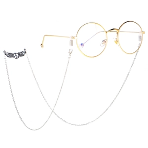 Silver wing peace charm glasses chain with gold round metal frames on white background