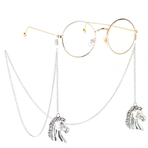 Silver metal eyewear chain with detailed horse head pendants on gold round glasses