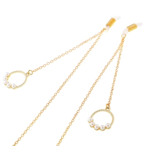 Golden eyewear chain with metal rings and white pearls on minimalist white background