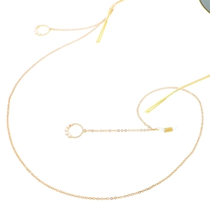 Golden metal eyewear chain featuring round faux pearl charms and anti-slip silicone loops