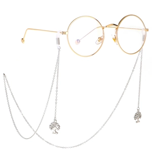 Silver eyeglasses chain with rhinestone tree of life pendant on gold metal frame glasses