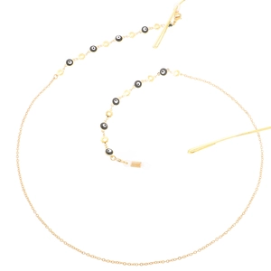 Golden eyewear chain with evil eye beads and floral accents on a white background