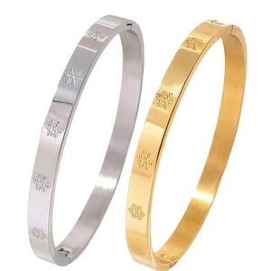 Elegant men's stainless steel bangle set in gold and silver with snowflake engravings