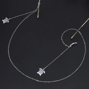 Silver chain glasses strap with white enamel turtle pendants and black flower pattern
