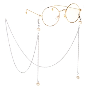 Retro round gold frame glasses with long silver chain and white pearl accents on white background