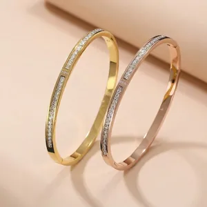 Luxe 18K gold and rose gold plated stainless steel bangles set with sparkling zircon stones