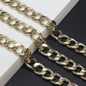 Close-up of thick gold-plated metal chain with polished oval links for eyewear or bags