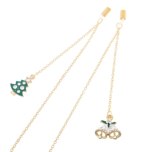 Golden Christmas eyewear chain with rhinestone tree and bell charms on white background