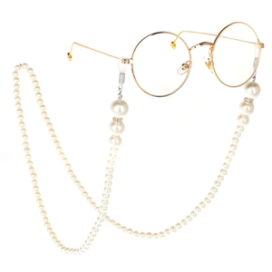 Elegant white pearl eyewear chain with gold metal glasses on a clean white background