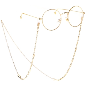 Lunettes dorées rétro à monture ronde avec chaîne en métal sur fond blanc