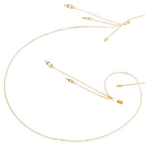 Golden eyewear chain with rhinestones and conical pendants on a white background