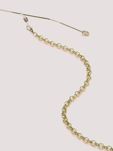 Detail of golden glasses chain showing the lobster clasp and anti-slip silicone loop