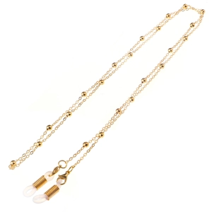 Detail of gold beaded glasses chain with lobster clasp and clear silicone anti-slip ends