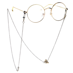 Lunettes rondes vintage dorées avec chaîne en métal ornée d'un pendentif papillon