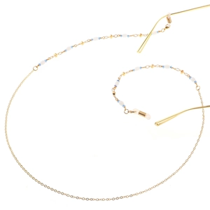 Chaîne de lunettes en métal doré avec perles en résine blanche et détails bleus élégants