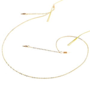 Golden metal eyewear chain featuring minimalist micro-pave studded cone pendants