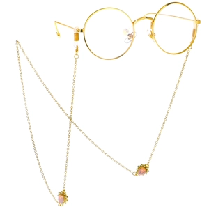 Golden chain eyewear holder with pink teardrop rhinestones and thin metal round frames