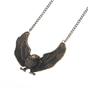 Vintage bronze eagle pendant on metallic chain necklace with detailed wing texture