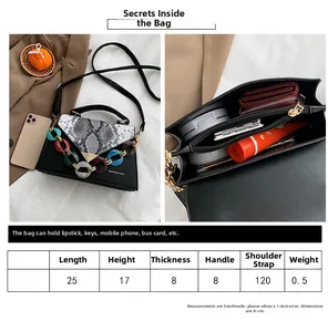 Detailed size chart for the snake skin texture handbag with internal storage compartments