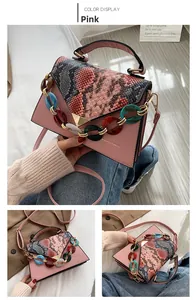 Pink lady handbag with V-flap snake skin pattern and colored acrylic chain detail