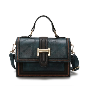 Vintage teal and brown oil-waxed crossbody bag with gold hardware and square top handle