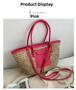 Detail of hand-woven straw tote bag with vibrant rose red leather trim and handle