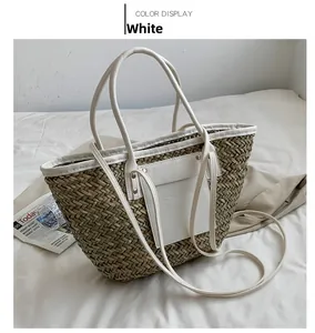 Detail of white straw tote bag with faux leather trim and detachable shoulder strap
