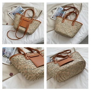 Detail view of woven straw tote bag with brown leather handles and front pocket detail