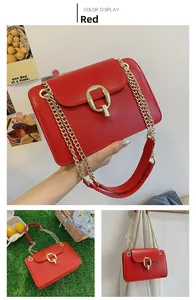 Detail of red leather chain bag showing gold square lock and metallic shoulder strap