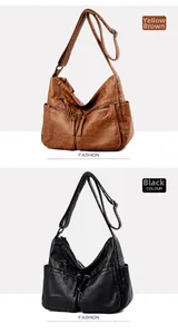 Detail view of the multi-zipper compartments on brown and black leather messenger bags