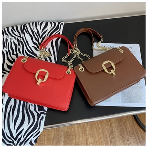 Chic red and brown crossbody bags featuring gold square buckles and metal chain straps