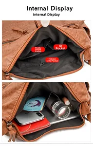 Internal view of brown leather handbag showing large capacity and organized pockets