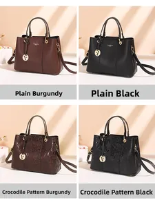 Detail view of burgundy and black crossbody bags with smooth and crocodile skin textures