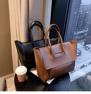 Chic leather tote bags in black and brown, perfect for professional women daily commute