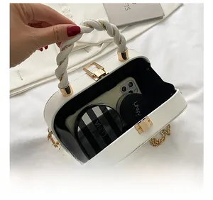 Interior view of white crossbody bag showing spacious capacity for phone and cosmetics