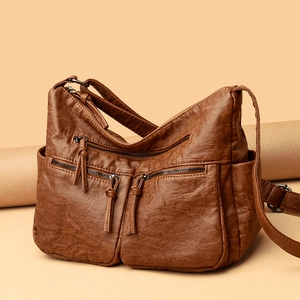 Vintage brown soft leather crossbody bag with multiple pockets and bronze metal zippers