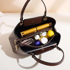 Brown lychee leather tote bag with multiple compartments and spacious interior
