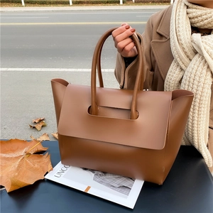 Classic large brown leather tote bag with double handles for commuter business chic style