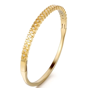 Detail of 18K gold-plated bangle featuring zircon star patterns and side hinge clasp design